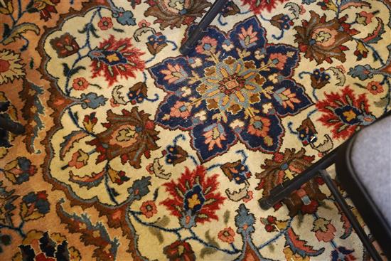 A Heriz ivory and blue ground carpet, 13ft by 10ft